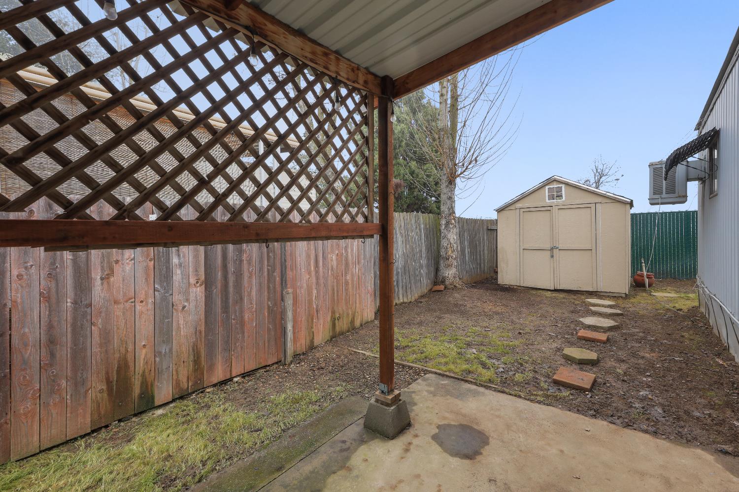19142 North Jack Tone Road, Unit 34 Lockeford, CA 95237 - Photo 5 of 21 a backyard of a house