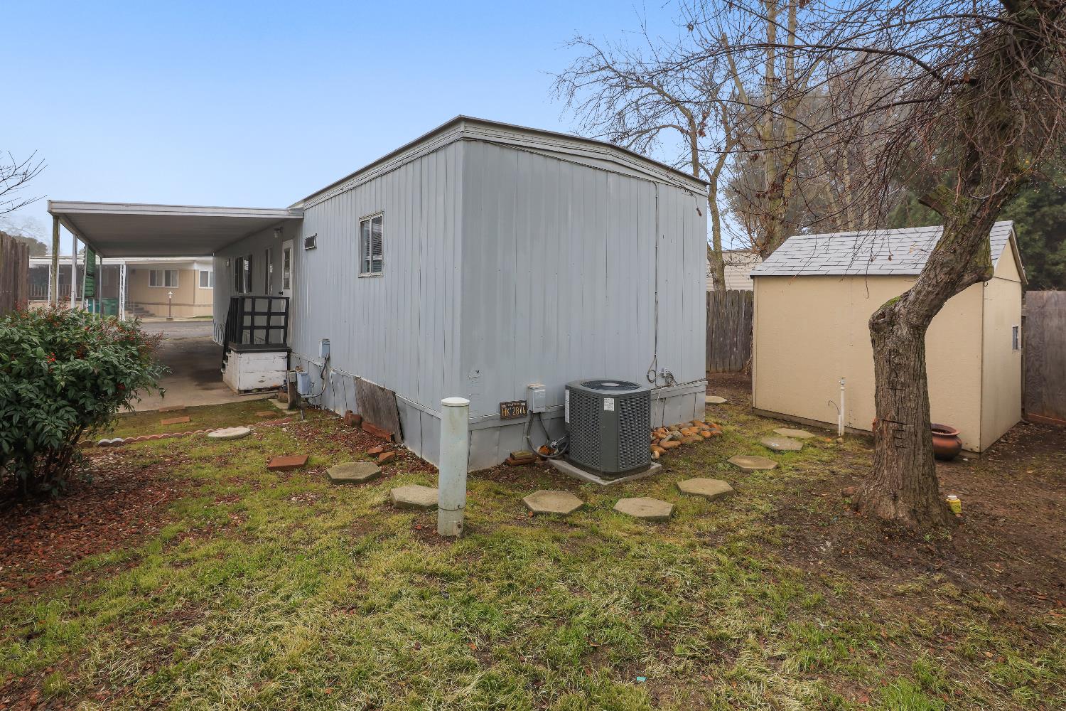 19142 North Jack Tone Road, Unit 34 Lockeford, CA 95237 - Photo 8 of 21 a backyard of a house with table and chairs