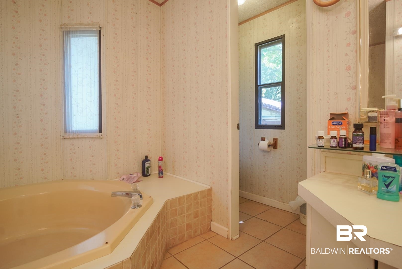9190 County Road 97 Elberta, AL 36530 - Photo 33 of 53 Bathroom with tile patterned flooring and a tub to relax in