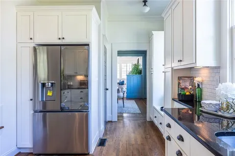 a kitchen with stainless steel appliances a stove top oven sink and window