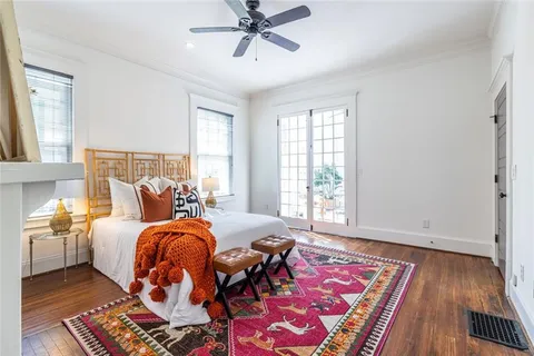 a bedroom with a bed and a fireplace