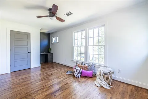 front view of a building with a garden