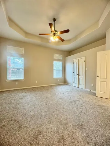 a view of an empty room and window