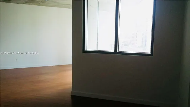 a bathroom with a shower and a toilet