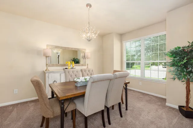 a view of a dining room with furniture window and outside view