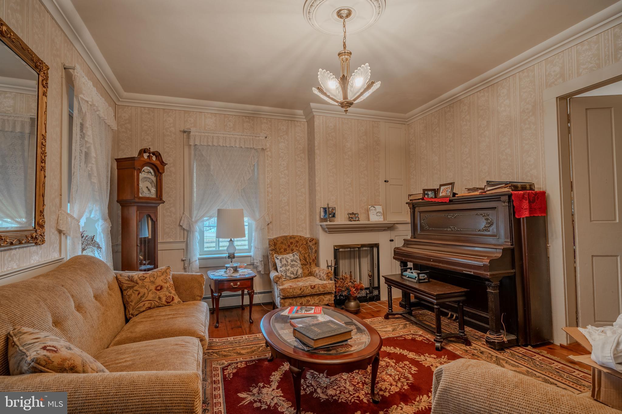155 Shady Hill Road Milton, PA 17847 - Photo 55 of 70 a living room with furniture a fireplace and a flat screen tv