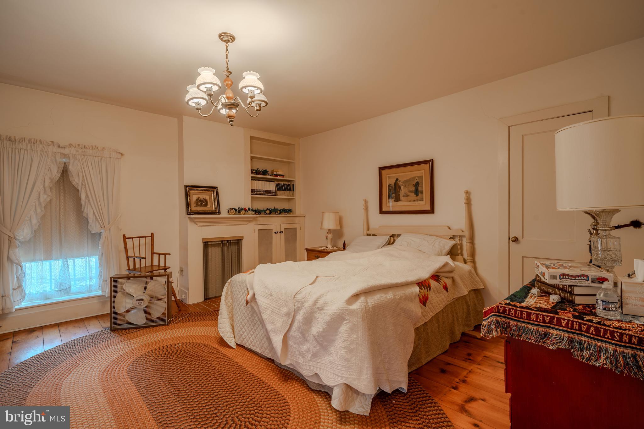 155 Shady Hill Road Milton, PA 17847 - Photo 65 of 70 a bedroom with a bed and a chandelier