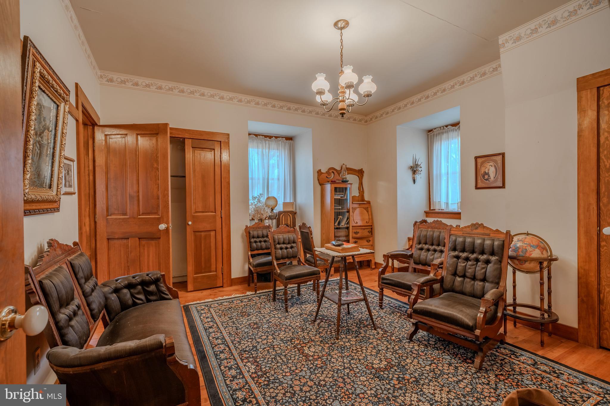 155 Shady Hill Road Milton, PA 17847 - Photo 69 of 70 a living room with furniture a dining table and a chandelier