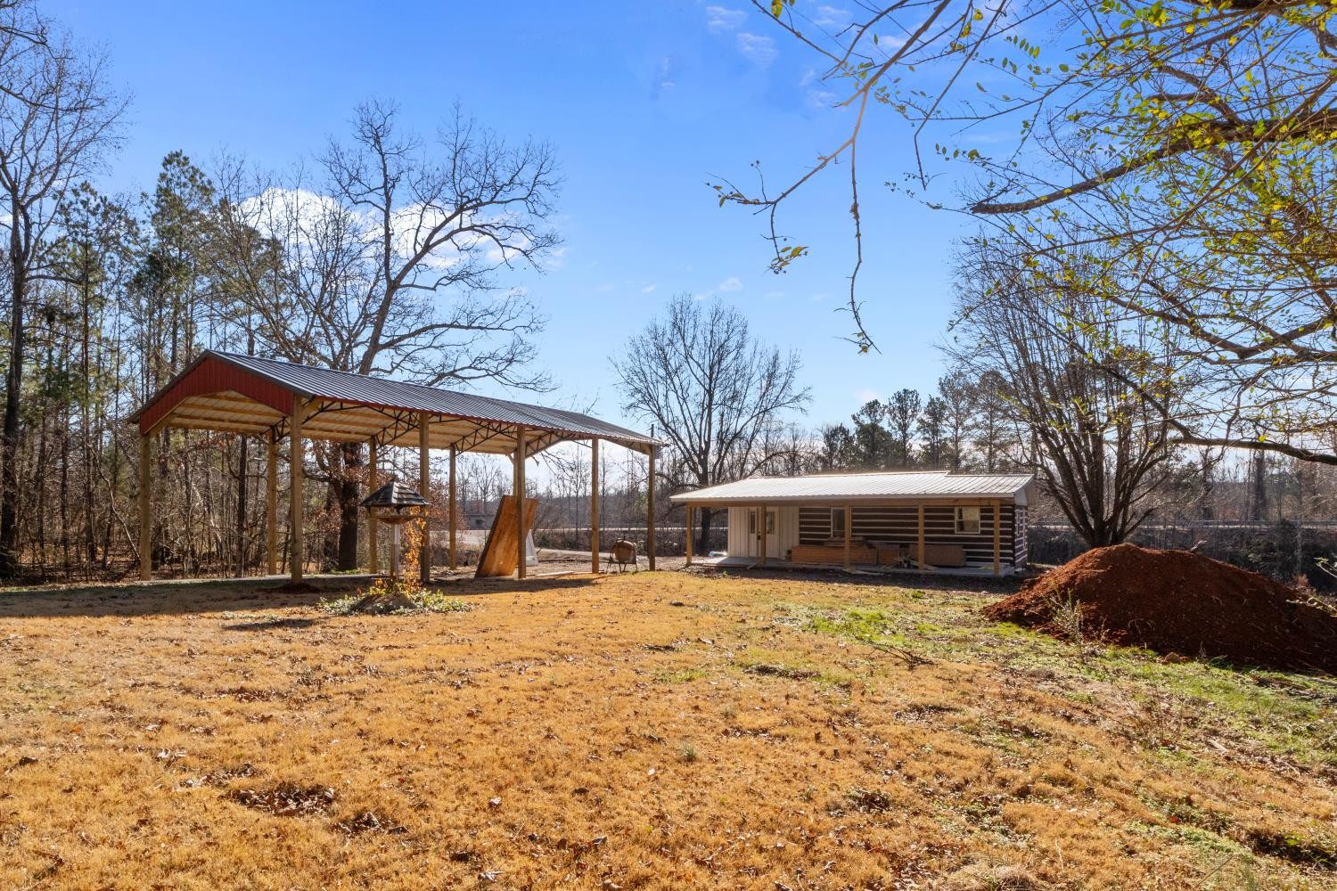 70 Old Bruceton Road Bruceton, TN 38317 - Photo 29 of 33 a front view of house with yard and trees in the background