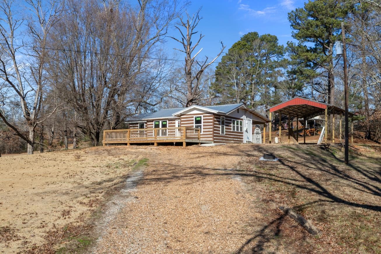 70 Old Bruceton Road Bruceton, TN 38317 - Photo 3 of 33 a view of a house with backyard and sitting area