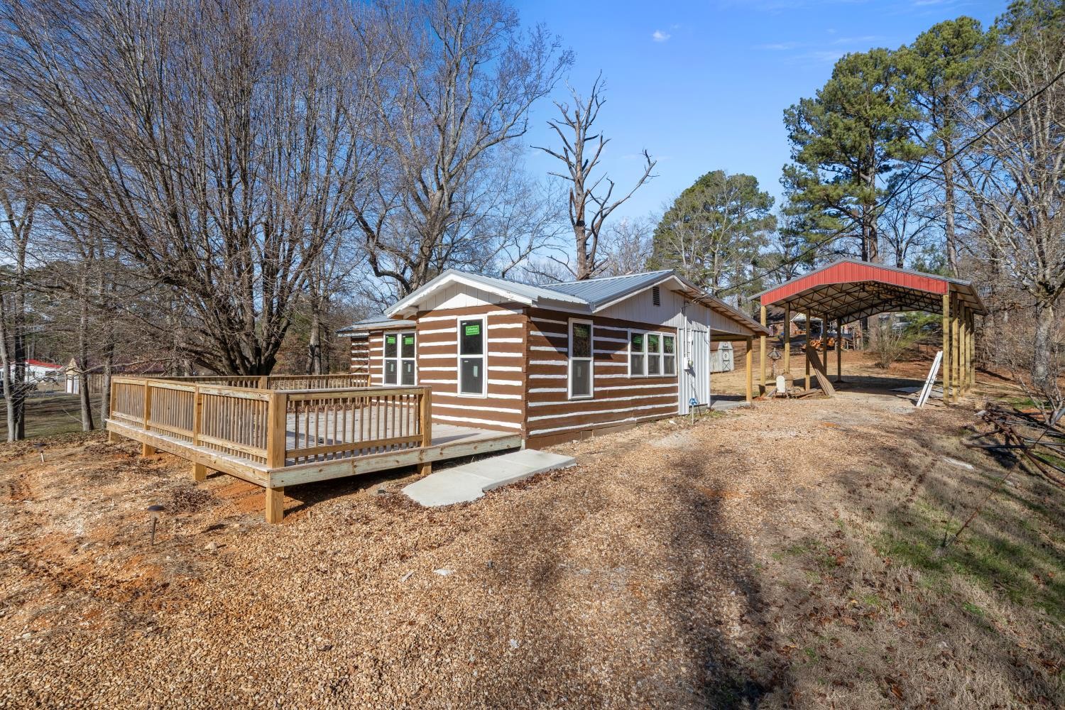 70 Old Bruceton Road Bruceton, TN 38317 - Photo 5 of 33 a view of a house with a yard and furniture
