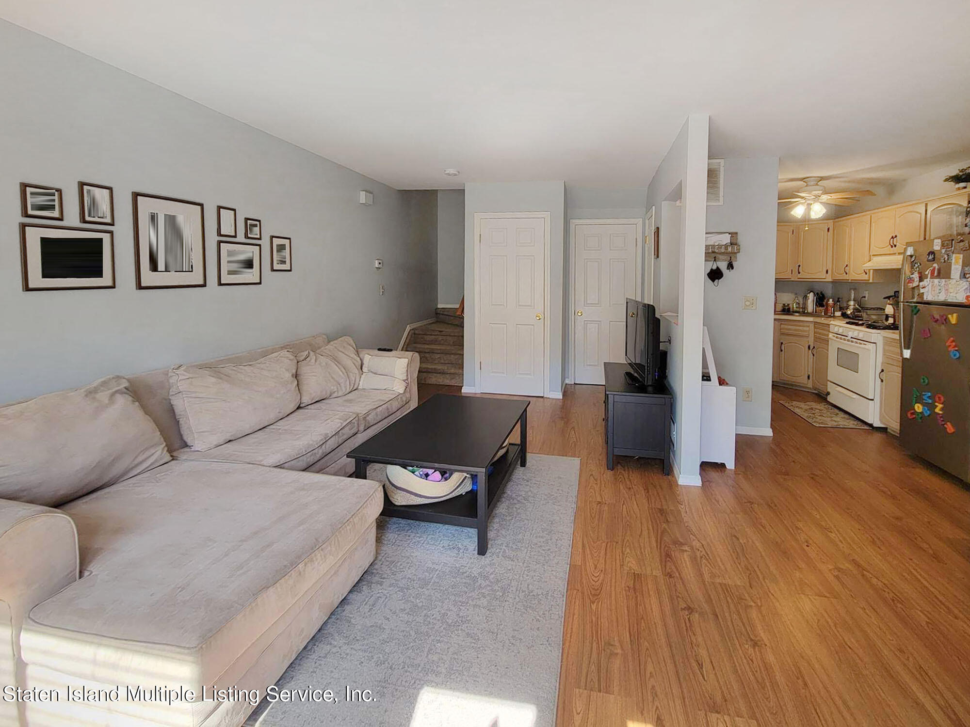 1040 Rathbun Avenue, Unit C Staten Island, NY 10309 - Photo 3 of 17 a living room with furniture and a wooden floor
