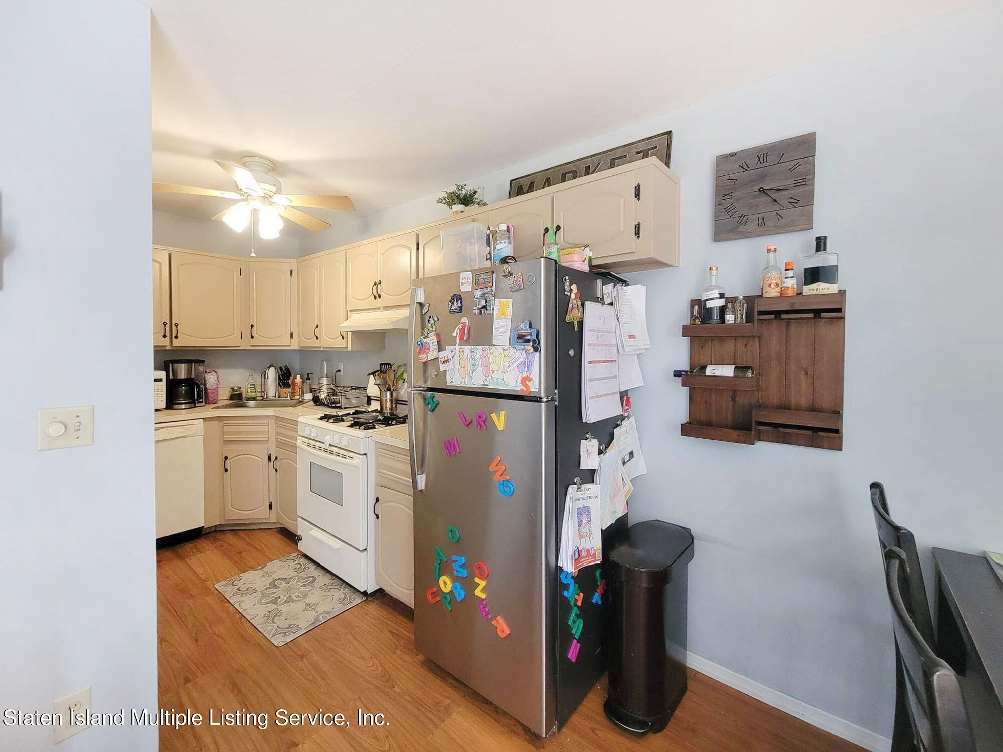 1040 Rathbun Avenue, Unit C Staten Island, NY 10309 - Photo 7 of 17 a kitchen with refrigerator and cabinets