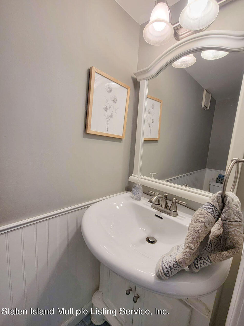 1040 Rathbun Avenue, Unit C Staten Island, NY 10309 - Photo 9 of 17 a bathroom with a sink and a mirror