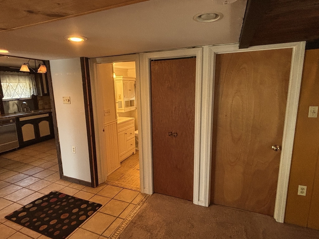 570 Eastside Road Wrentham, MA 02093 - Photo 13 of 31 a view of walk in closet with wooden floor
