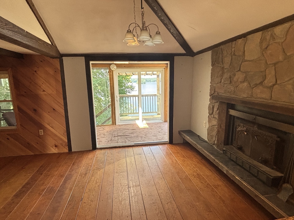 570 Eastside Road Wrentham, MA 02093 - Photo 14 of 31 a view of an empty room with wooden floor and a window