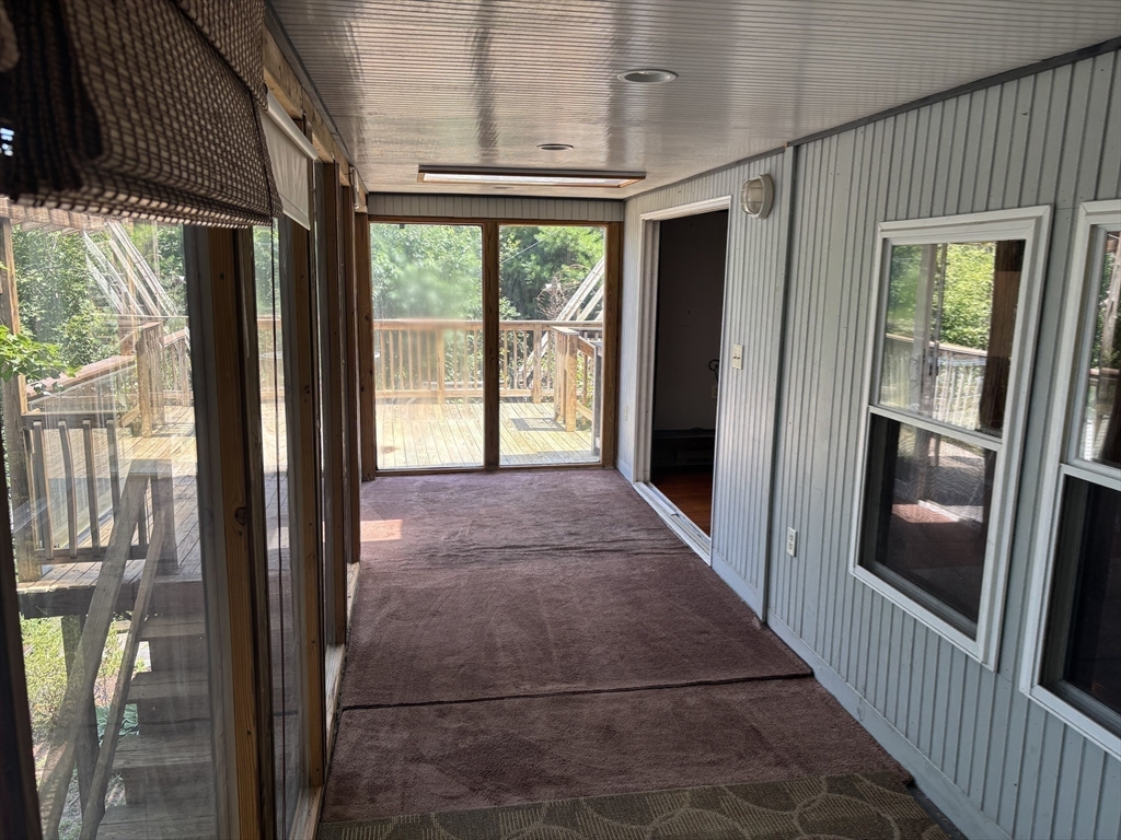 570 Eastside Road Wrentham, MA 02093 - Photo 20 of 31 a view of a hallway with wooden floor and stairs
