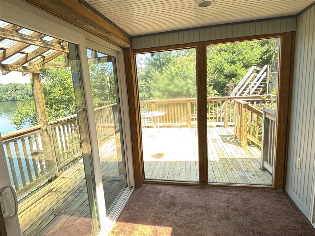 570 Eastside Road Wrentham, MA 02093 - Photo 21 of 31 a view of a room with large windows