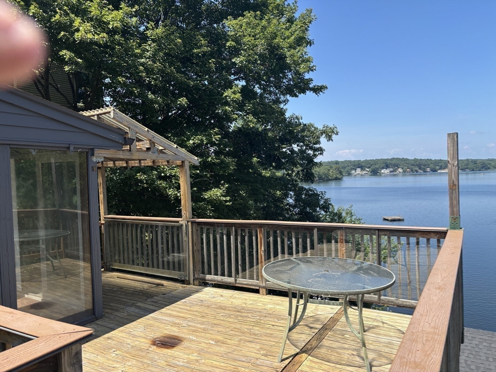570 Eastside Road Wrentham, MA 02093 - Photo 24 of 31 a view of a chairs and table on the deck