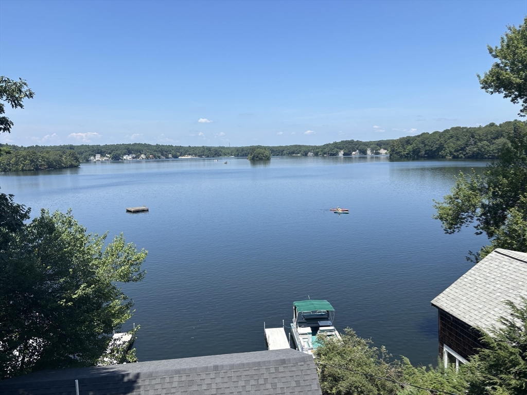 570 Eastside Road Wrentham, MA 02093 - Photo 30 of 31 a view of a lake with a mountain in the background