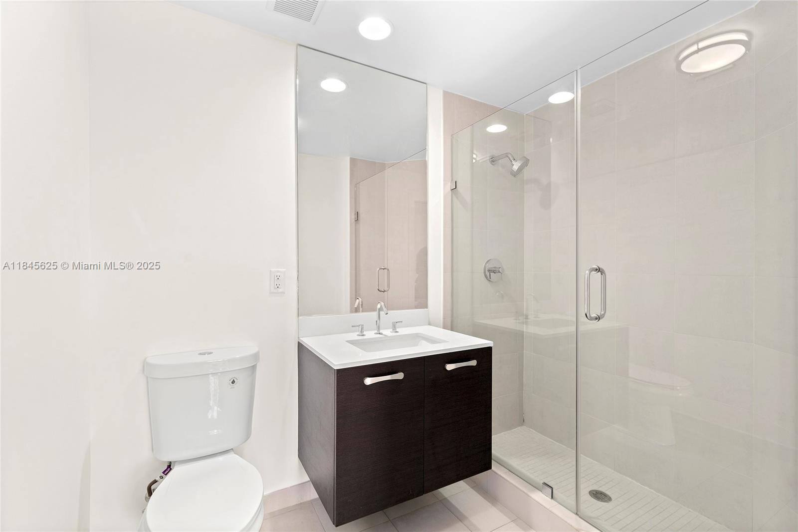 811 Southeast 12th Court Fort Lauderdale, FL 33316 - Photo 12 of 18 a bathroom with a sink toilet and shower