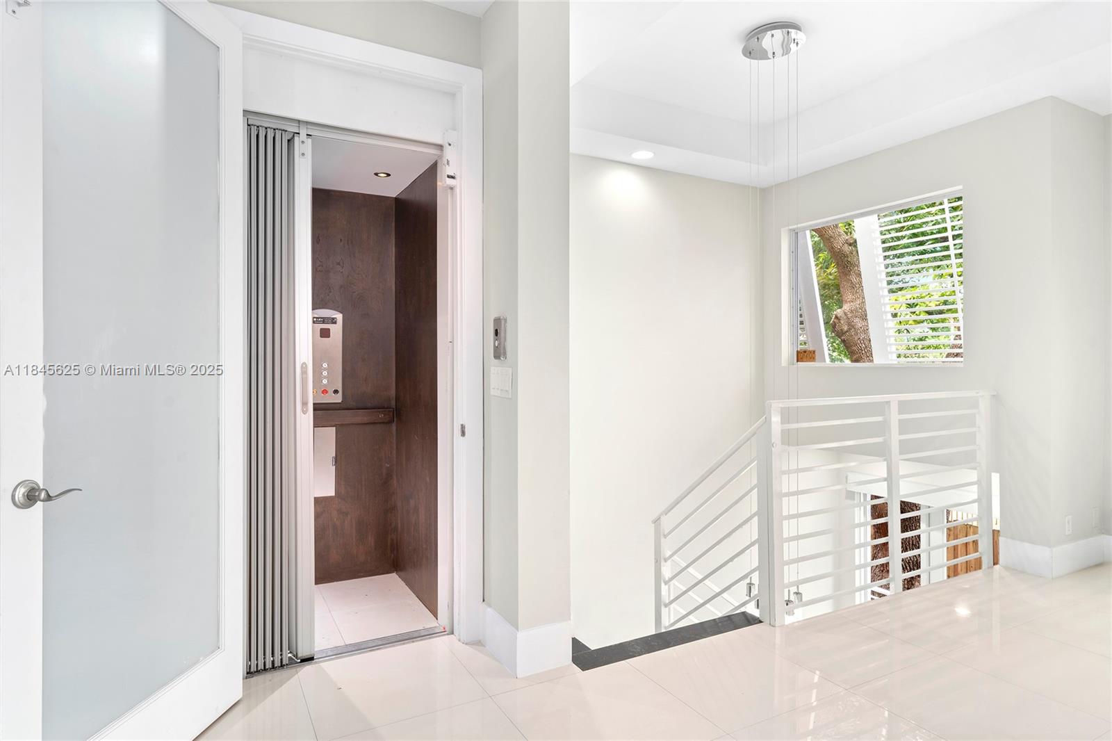 811 Southeast 12th Court Fort Lauderdale, FL 33316 - Photo 8 of 18 a view of a livingroom with a hall and an entryway