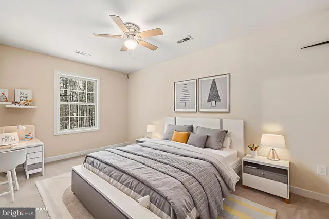 a bedroom with a large bed and a window