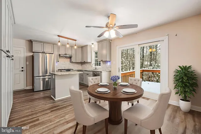 a view of a dining room with furniture window and wooden floor