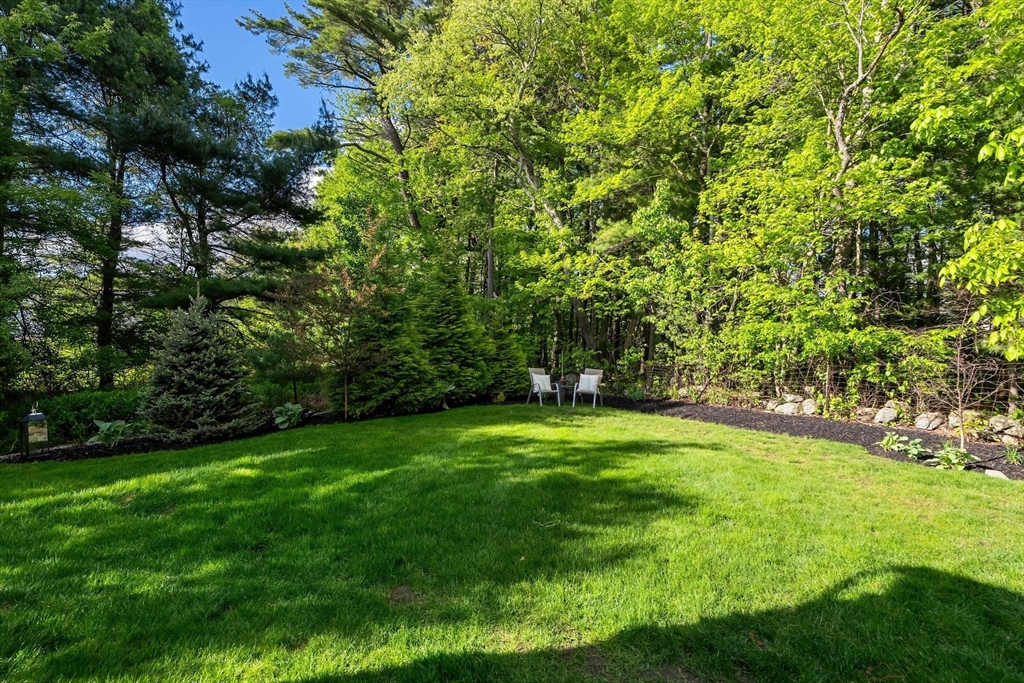 2 Hummingbird Way, Unit 1 Methuen, MA 01844 - Photo 37 of 42 a view of a trees with a yard