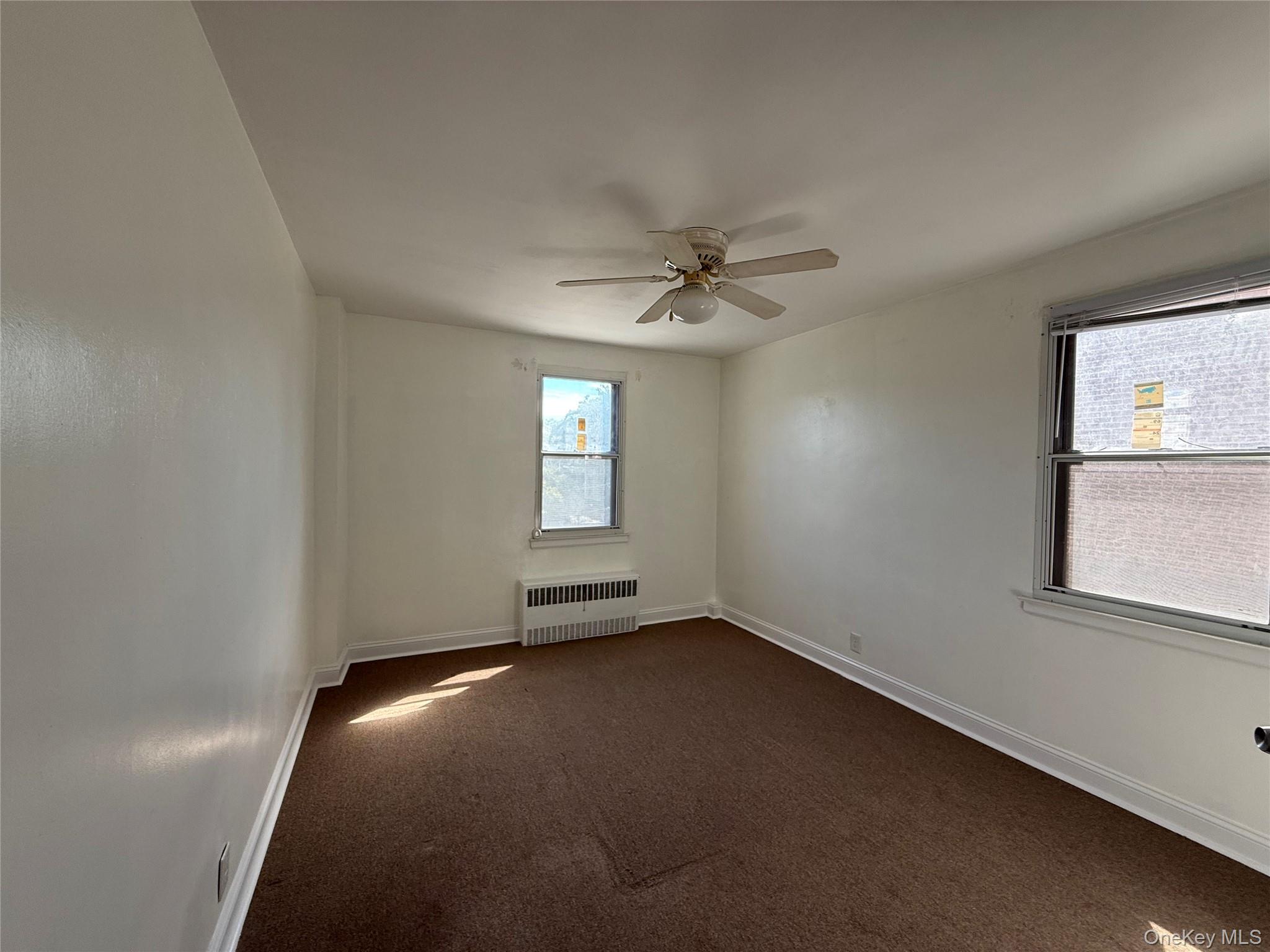 142 Garth Road, Unit 1P Scarsdale, NY 10583 - Photo 14 of 22 an empty room with a window