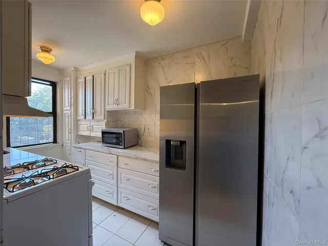 a kitchen with a stove and a microwave
