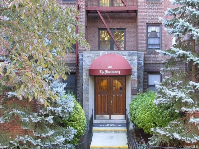 a front view of a house with yard