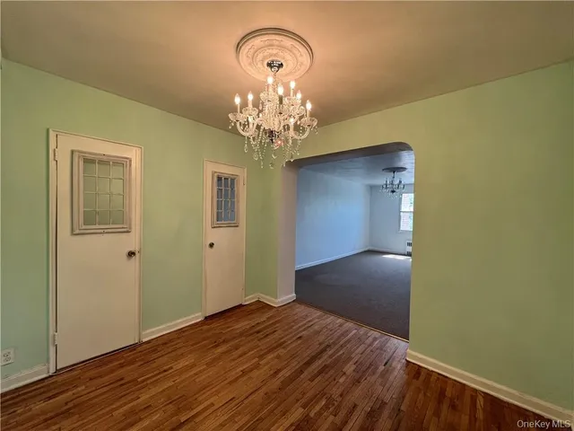 a view of a livingroom with wooden floor