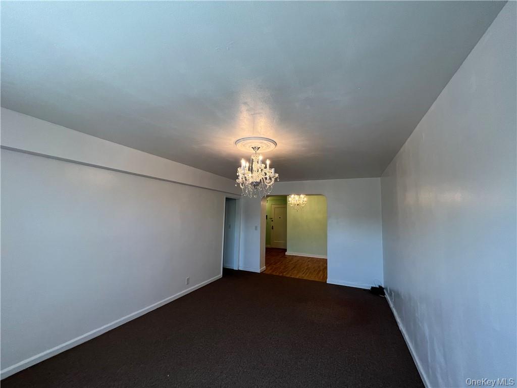 142 Garth Road, Unit 1P Scarsdale, NY 10583 - Photo 10 of 22 a view of a chandelier fan and entryway