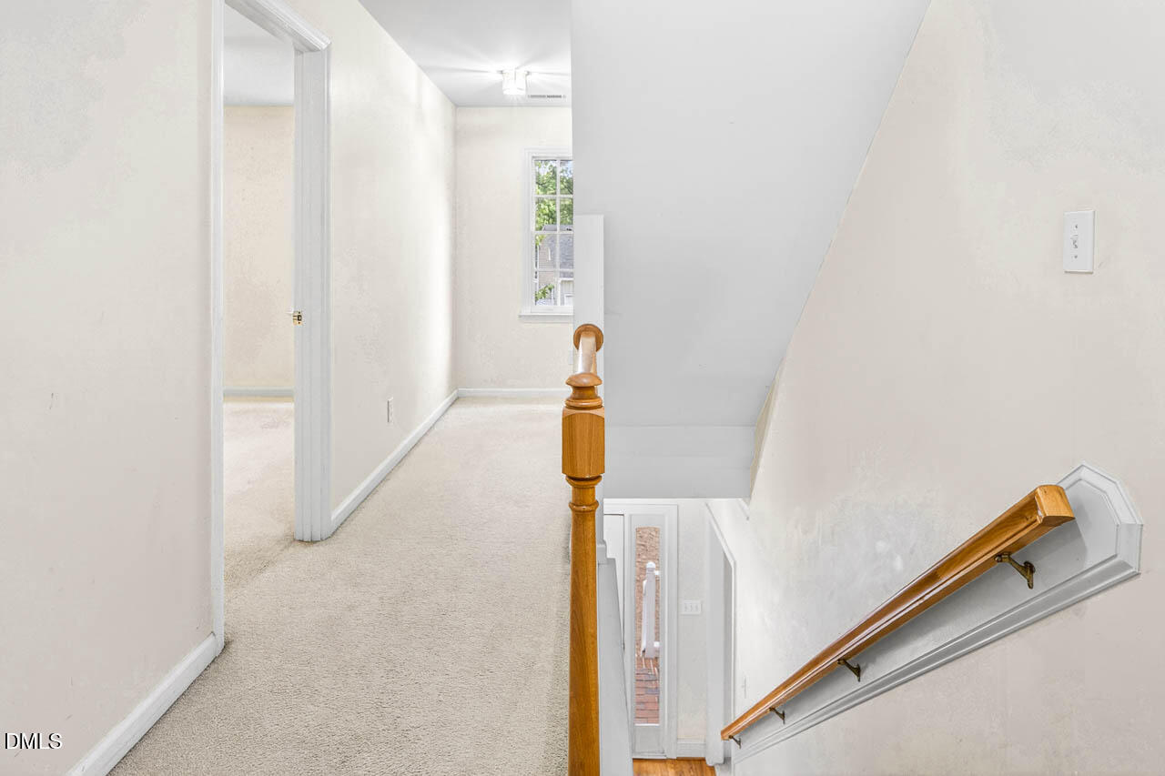 2209 Lodestar Drive Raleigh, NC 27615 - Photo 33 of 50 a view of hallway with stairs
