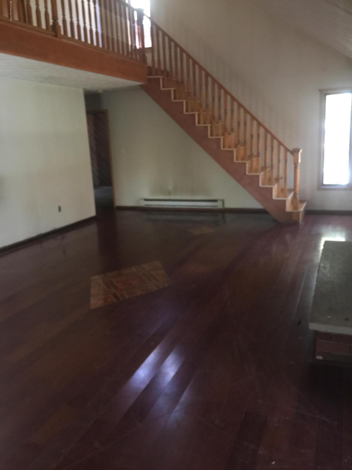 6220 Decker Road Bushkill, PA 18324 - Photo 3 of 13 a view of entryway and hall with wooden floor
