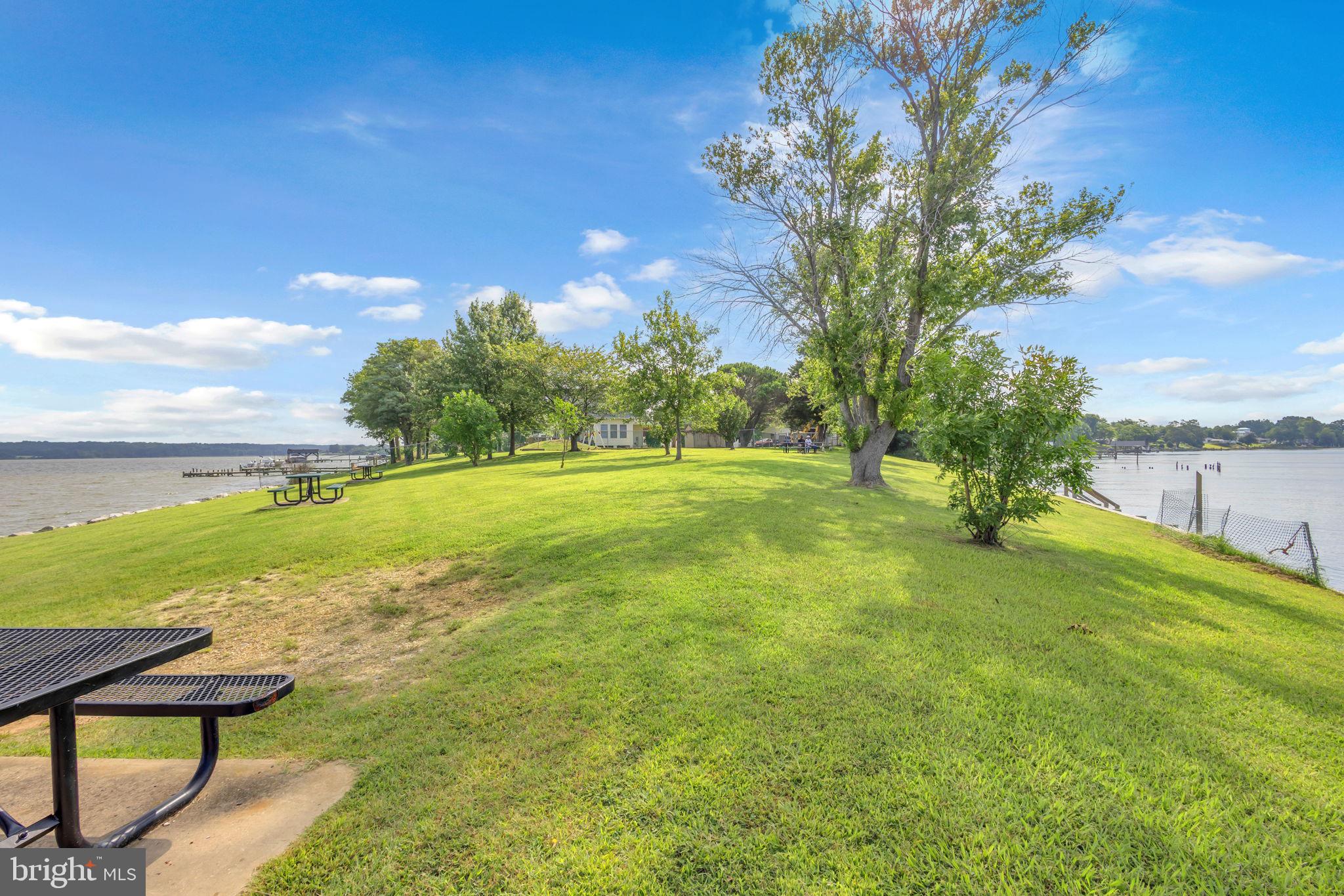 36031 Bay Drive Chaptico, MD 20621 - Photo 19 of 34 a view of a golf course with a lake view