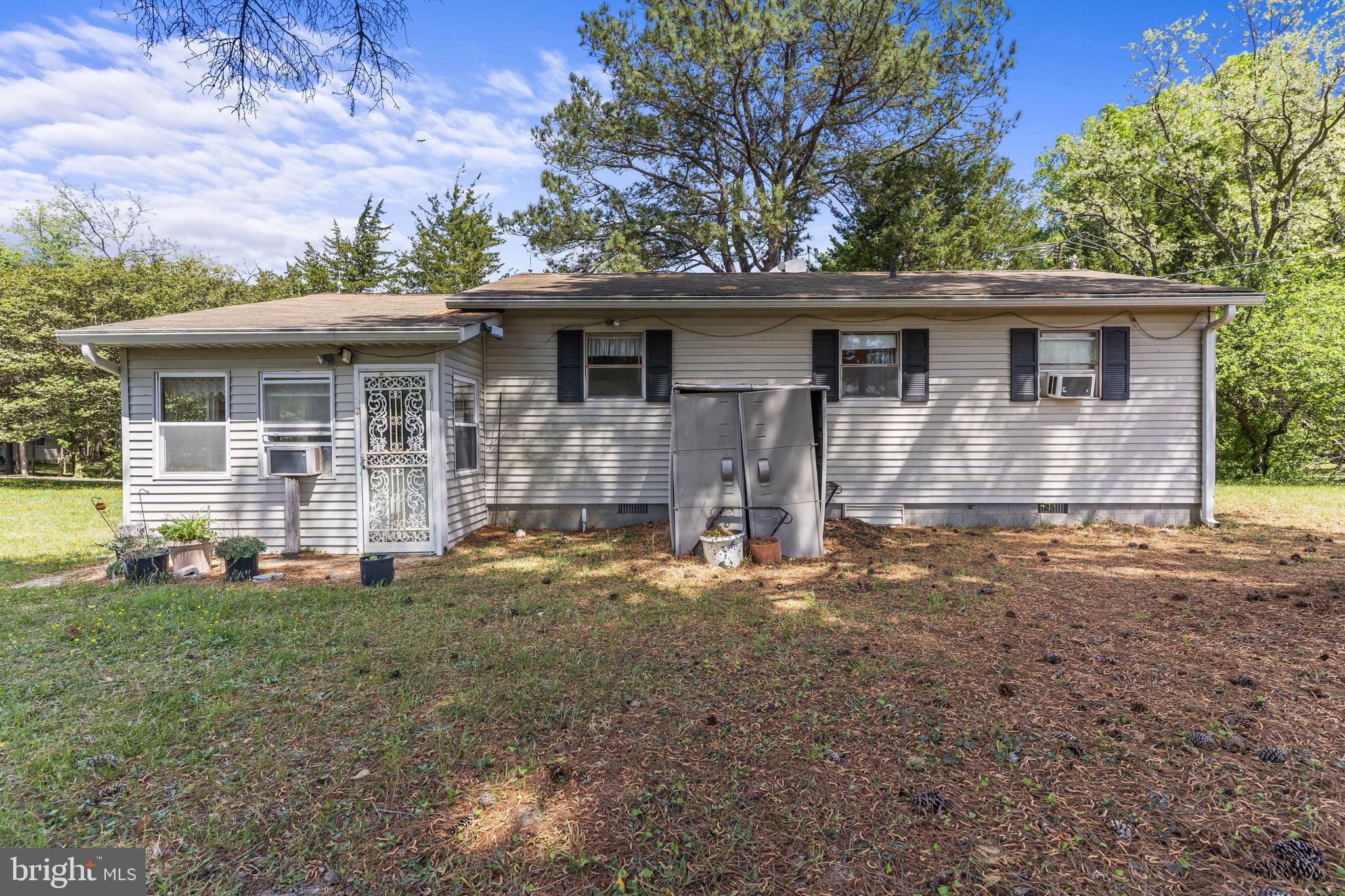 36031 Bay Drive Chaptico, MD 20621 - Photo 28 of 34 a front view of a house with a yard