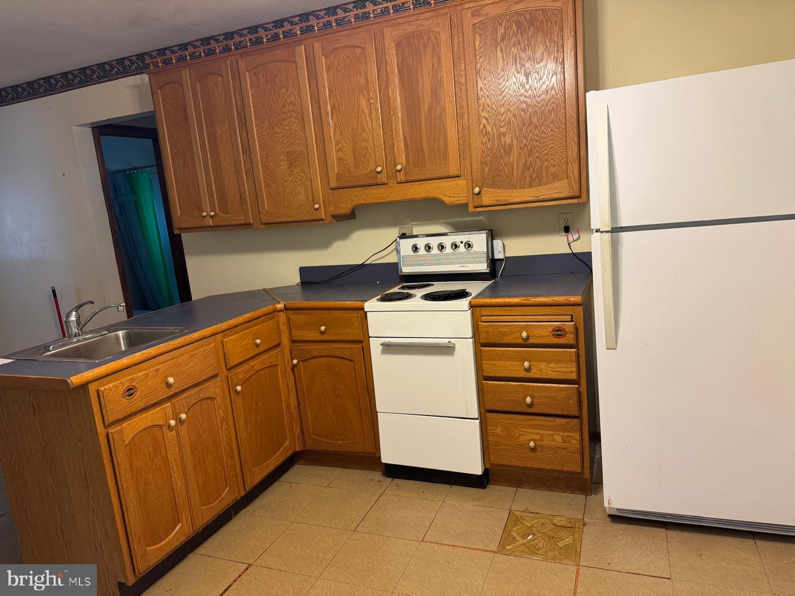 36031 Bay Drive Chaptico, MD 20621 - Photo 4 of 34 a kitchen with appliances cabinets and a counter top space