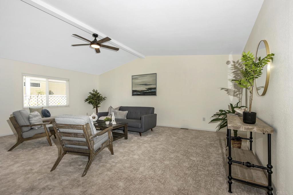 5212 Weymouth Way Oceanside, CA 92057 - Photo 12 of 39 a living room with furniture and a potted plant