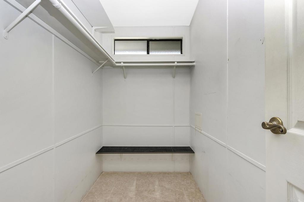 5212 Weymouth Way Oceanside, CA 92057 - Photo 20 of 39 a view of an empty walk in closet