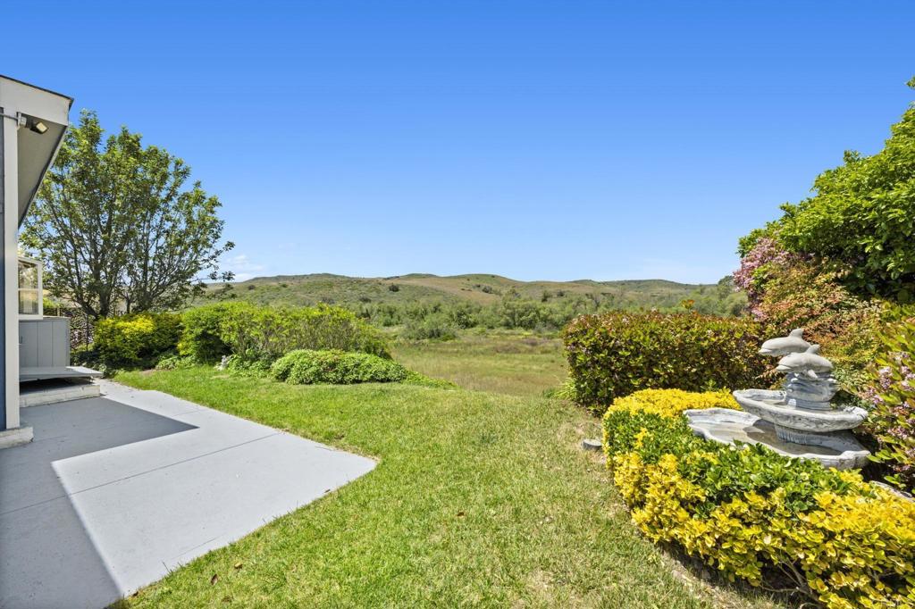 5212 Weymouth Way Oceanside, CA 92057 - Photo 3 of 39 a view of a lake with a mountain in the background