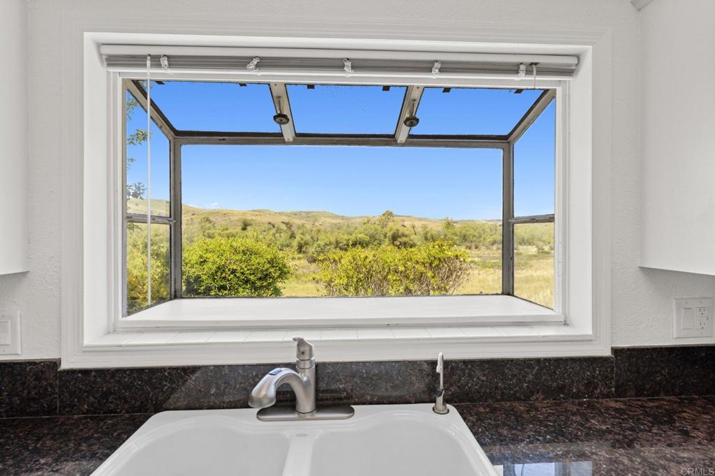 5212 Weymouth Way Oceanside, CA 92057 - Photo 8 of 39 a bathroom with a sink and a window