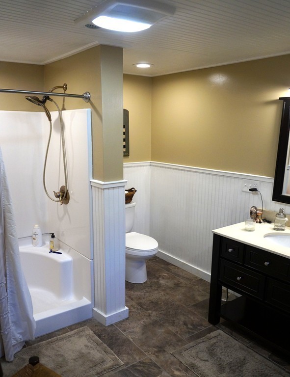 7 Pryor Road Natick, MA 01760 - Photo 13 of 24 a bathroom with a sink a toilet and shower