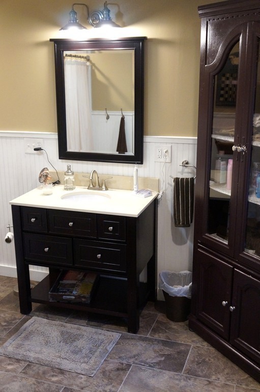 7 Pryor Road Natick, MA 01760 - Photo 14 of 24 a bathroom with a sink a toilet and mirror