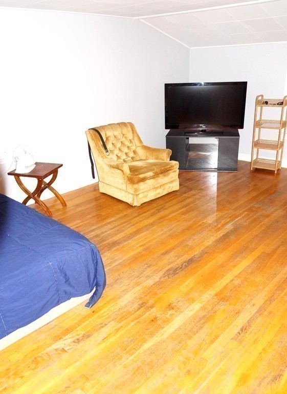 7 Pryor Road Natick, MA 01760 - Photo 15 of 24 a living room with furniture and a flat screen tv