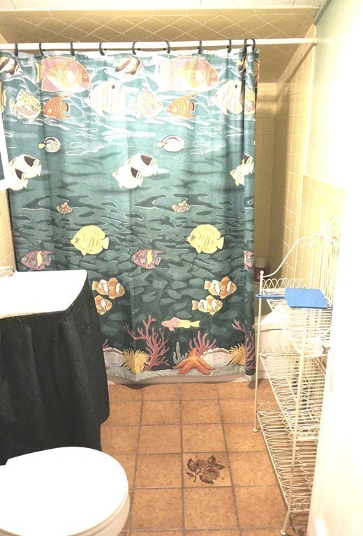 7 Pryor Road Natick, MA 01760 - Photo 17 of 24 a bathroom with a sink toilet and shower