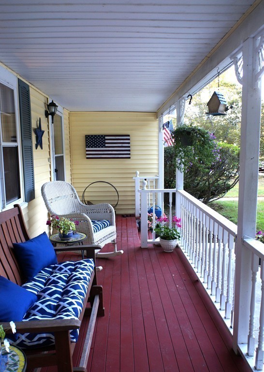7 Pryor Road Natick, MA 01760 - Photo 2 of 24 a view of balcony with furniture and a grill