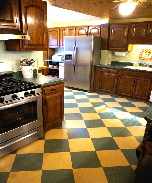 7 Pryor Road Natick, MA 01760 - Photo 6 of 24 a kitchen with granite countertop stainless steel appliances and sink