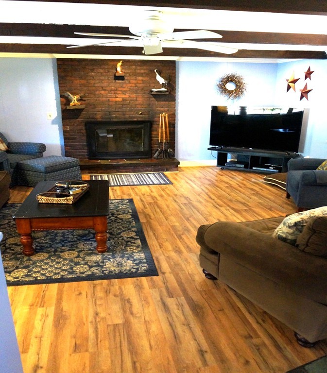 7 Pryor Road Natick, MA 01760 - Photo 9 of 24 a living room with furniture and a fireplace